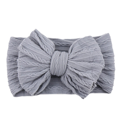 Graues Baby-Stirnband aus Baumwolle mit Schleife, gestrickt, modisches Accessoire.