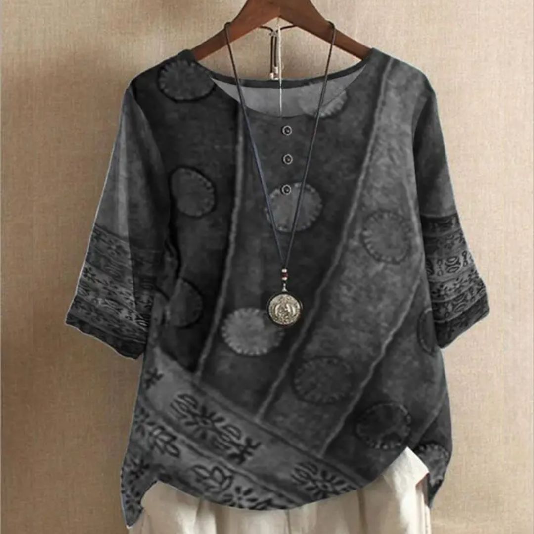 Graues Damenbluse mit Muster, Rundhalsausschnitt, Dreiviertelärmel, lässiger Stil.