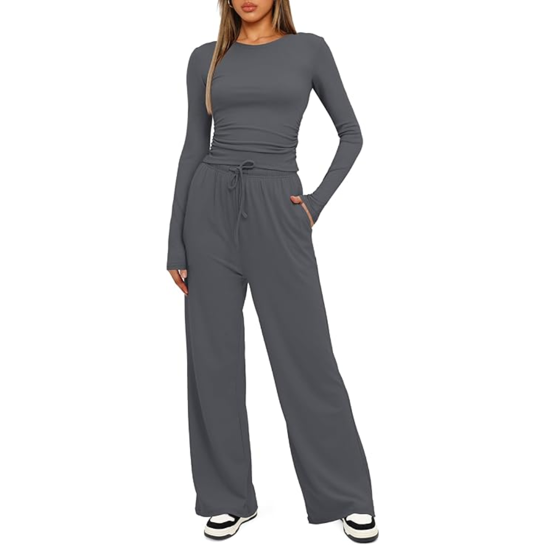 Frau in grauem Langarm-Jumpsuit, lässig, bequem, modisch, Damenbekleidung, Freizeitlook.