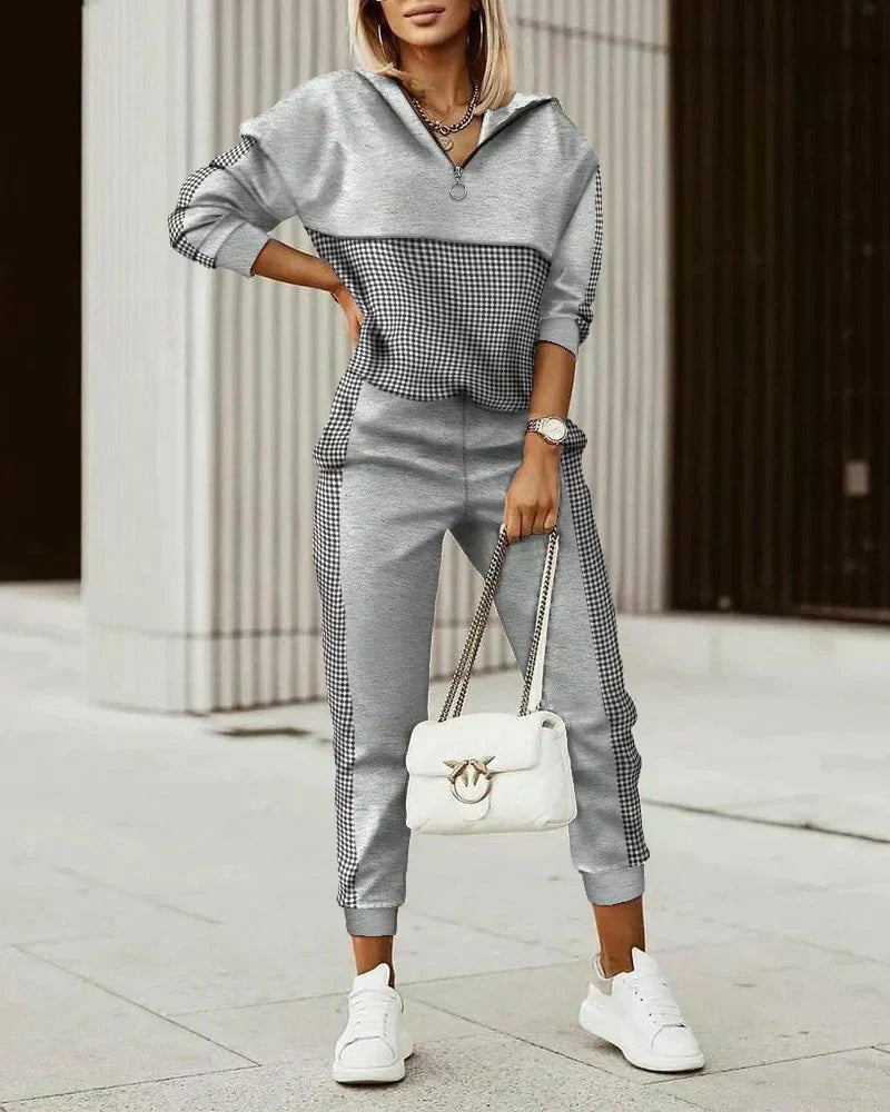Graues Damen-Trainingsanzug-Set, kariertes Design, modern, bequem, mit weißer Handtasche.