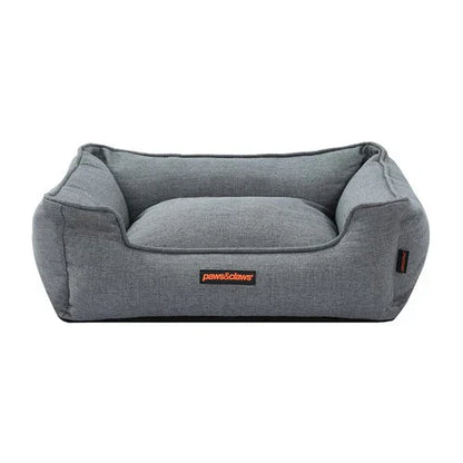 Graues Hundebett aus Stoff, rechteckig, bequem, ideal für mittelgroße Hunde.