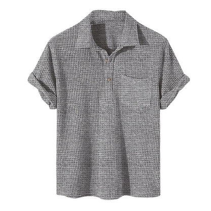 Graues Herren-Poloshirt aus Baumwolle, kurzärmelig, geripptes Design, Freizeitmode.