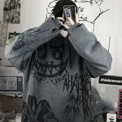 Grauer Oversize-Pullover mit schwarzem Graffiti-Design, Unisex Streetwear, Baumwolle.