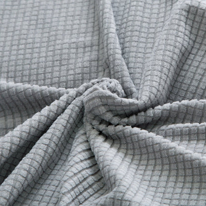 Grauer Waffelstoff, weiche Textur, Baumwolle, ideal für Heimtextilien und Bekleidung.