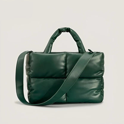Grüne gesteppte Handtasche aus Leder mit Schulterriemen, modisch und elegant.