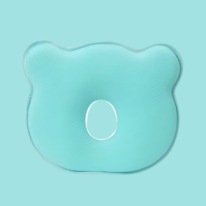 Grünes ergonomisches Babykissen aus Schaumstoff, bärenförmig, zur Kopfunterstützung.