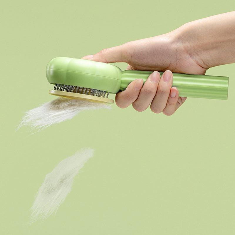Grüne Haustierbürste mit Haaren, ergonomischer Griff, ideal für Fellpflege.