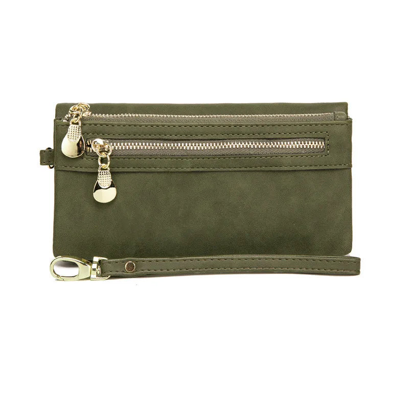 Grüne Lederhandgelenktasche mit Reißverschlüssen, Damenmode-Accessoire, elegant und praktisch.