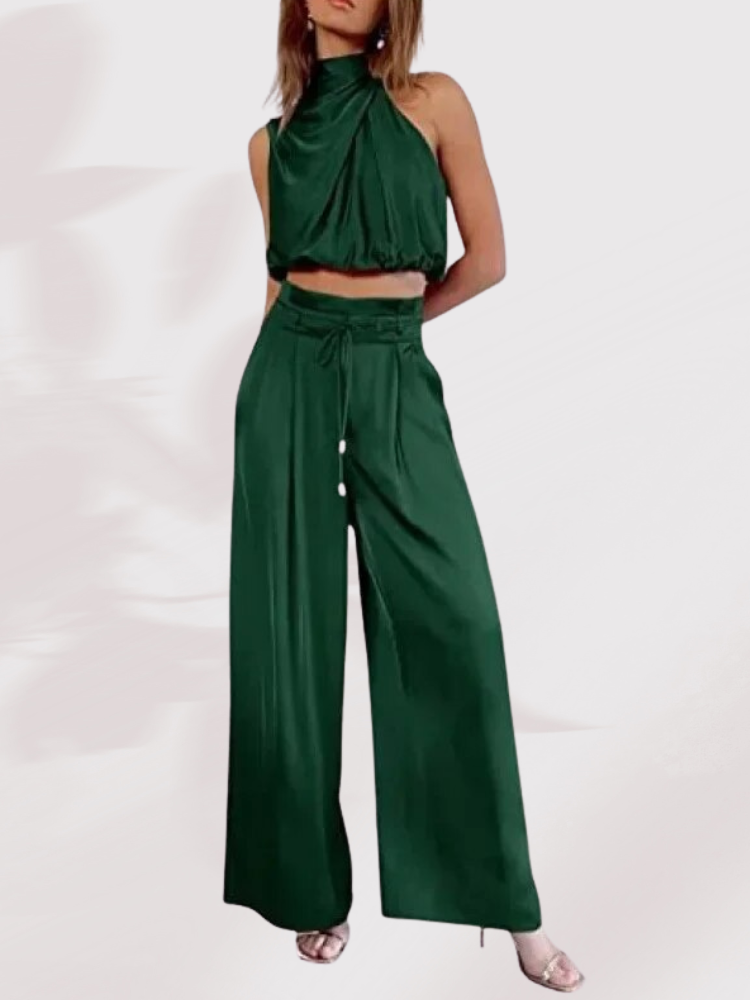 Grünes Damen-Zweiteiler-Set, ärmelloses Oberteil, weite Hose, elegantes Outfit.