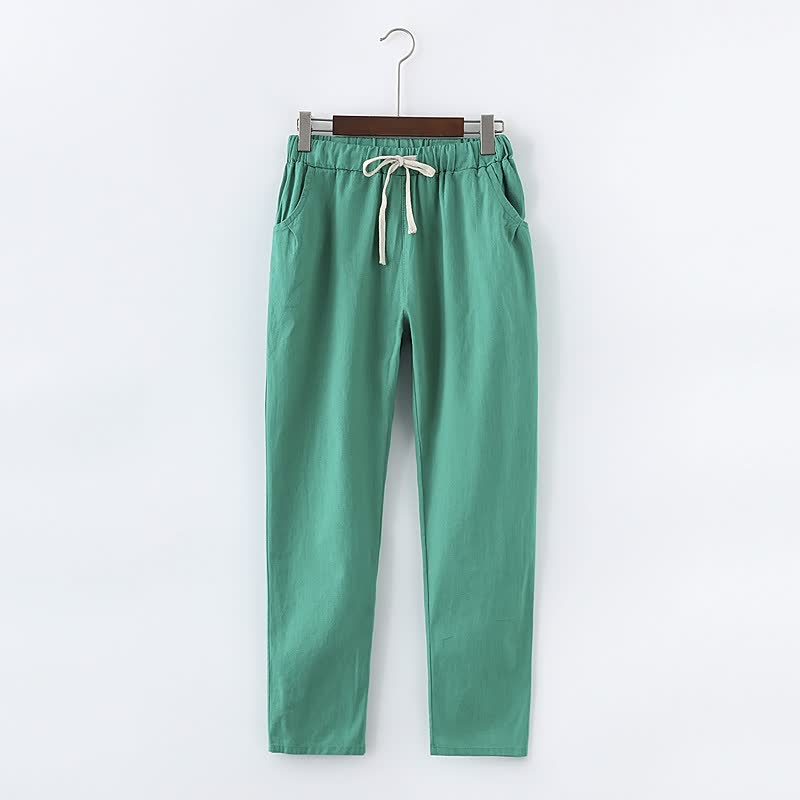 Grüne Baumwollhose mit Kordelzug, lässige Passform, ideal für Freizeitkleidung.