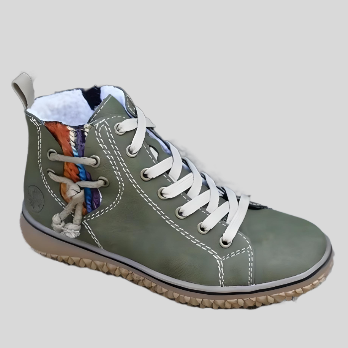 Grüner Damen-Sneaker aus Leder mit bunter Verzierung und weißer Sohle, modisch und bequem.