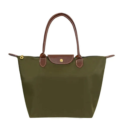 Grüne Damenhandtasche aus Nylon mit braunen Ledergriffen, elegantes Design.