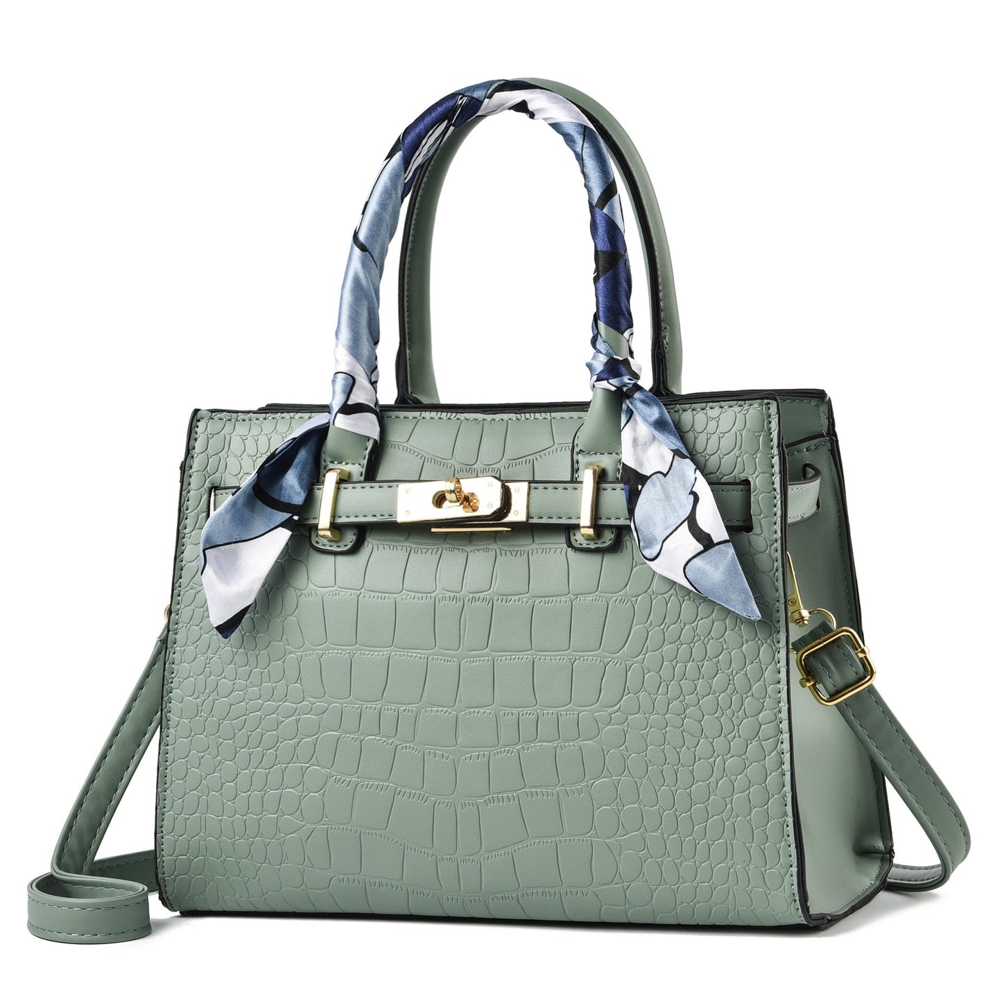 Grüne Damenhandtasche aus Leder mit Krokodilprägung und Seidenschal, modisch und elegant.