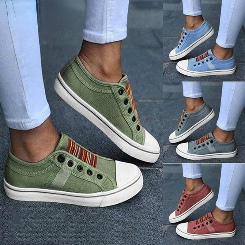 Grüne Canvas-Sneaker für Damen, lässig, bequem, mit Streifenmuster, modisch.