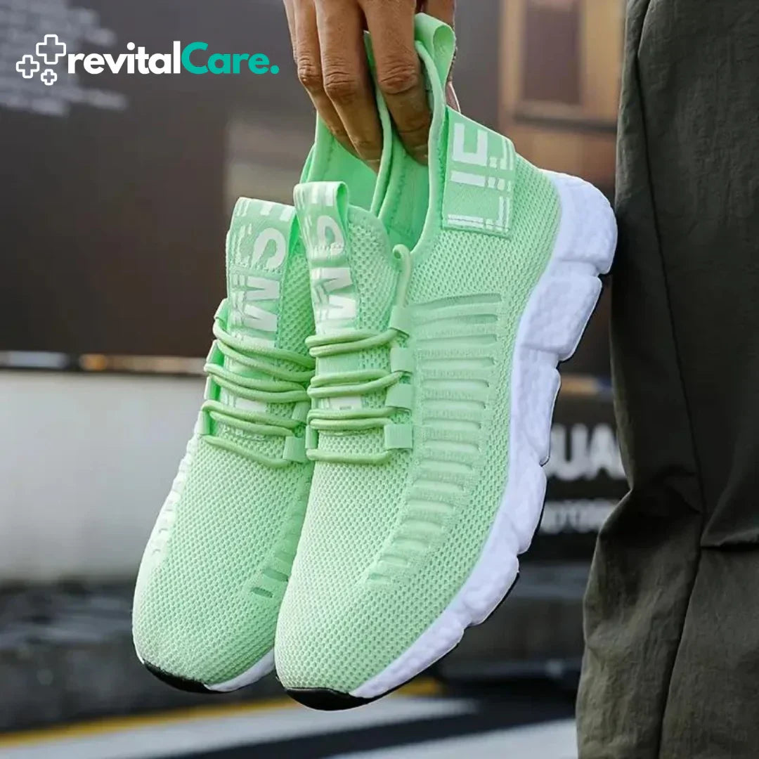 Grüne Sportschuhe aus Mesh mit weißer Sohle, ideal für Laufen und Fitness.