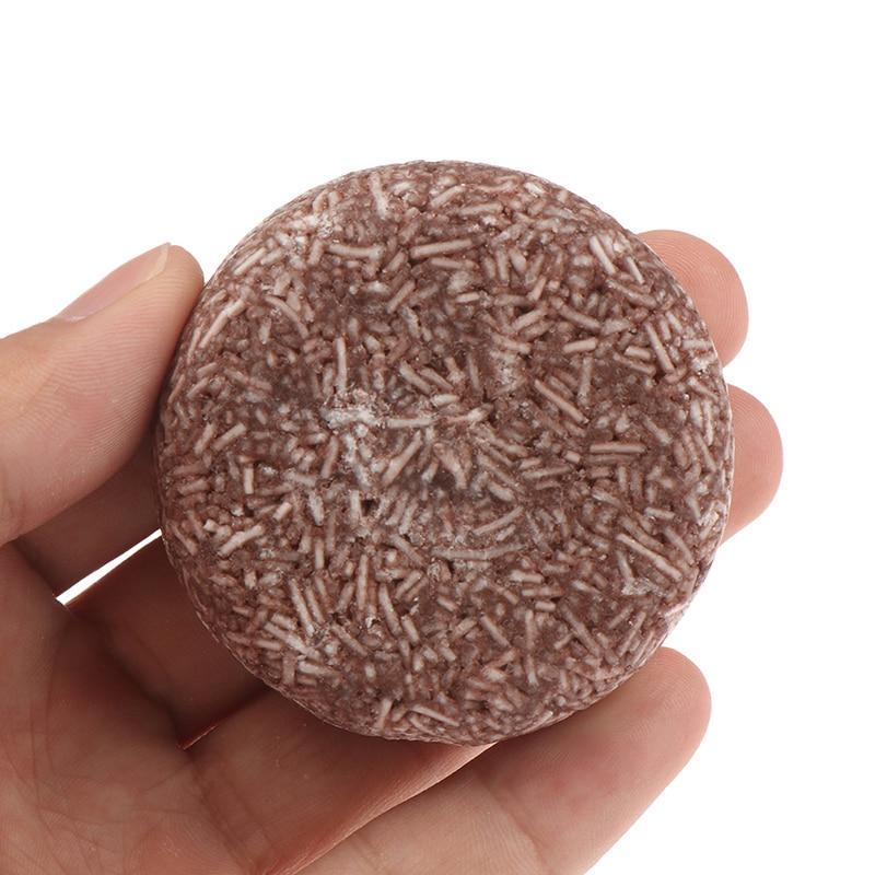 Braune Shampoo-Bar, natürliche organische Formel, handgehalten, Haarpflege, umweltfreundlich.