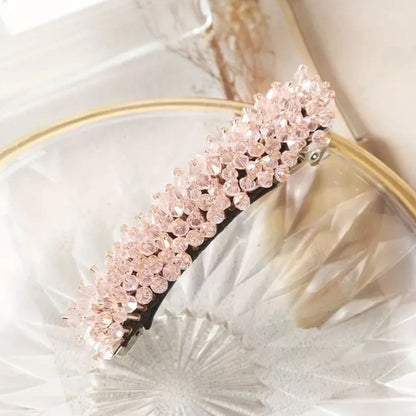 Rosa Haarklammer mit Kristallperlen, elegantes Haaraccessoire, modisch und stilvoll.