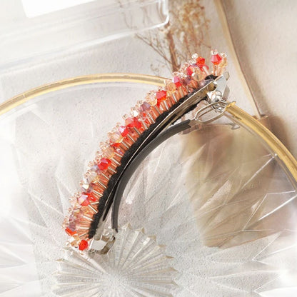 Haarspange mit roten Kristallen, elegantes Design, modisches Accessoire, Damenhaarschmuck.