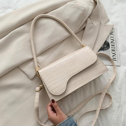 Beige Damenhandtasche aus Kunstleder mit Krokodilprägung, Umhängetasche, modisch, elegant.