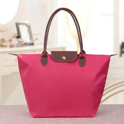 Rosa Damenhandtasche aus Leder, elegantes Design, modisches Accessoire, Alltagsgebrauch.