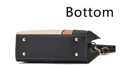Schwarze Lederhandtasche mit goldenen Nieten, Bodenansicht, modisch, elegant, Damenaccessoire.