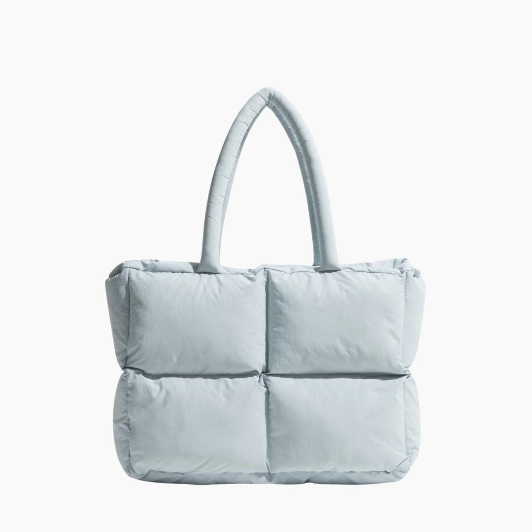Hellblaue gesteppte Handtasche, Damenmode, modisches Accessoire, elegantes Design, Einkaufstasche.