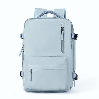 Hellblauer Rucksack, rechteckig, mit mehreren Reißverschlusstaschen, ideal für Schule oder Reisen.