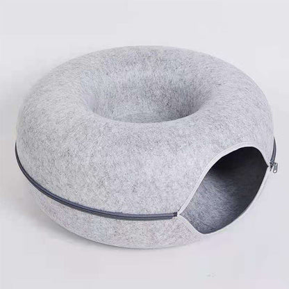 Hellgraues Katzenbett aus Filz mit Reißverschluss, rundes Design, gemütlicher Schlafplatz.