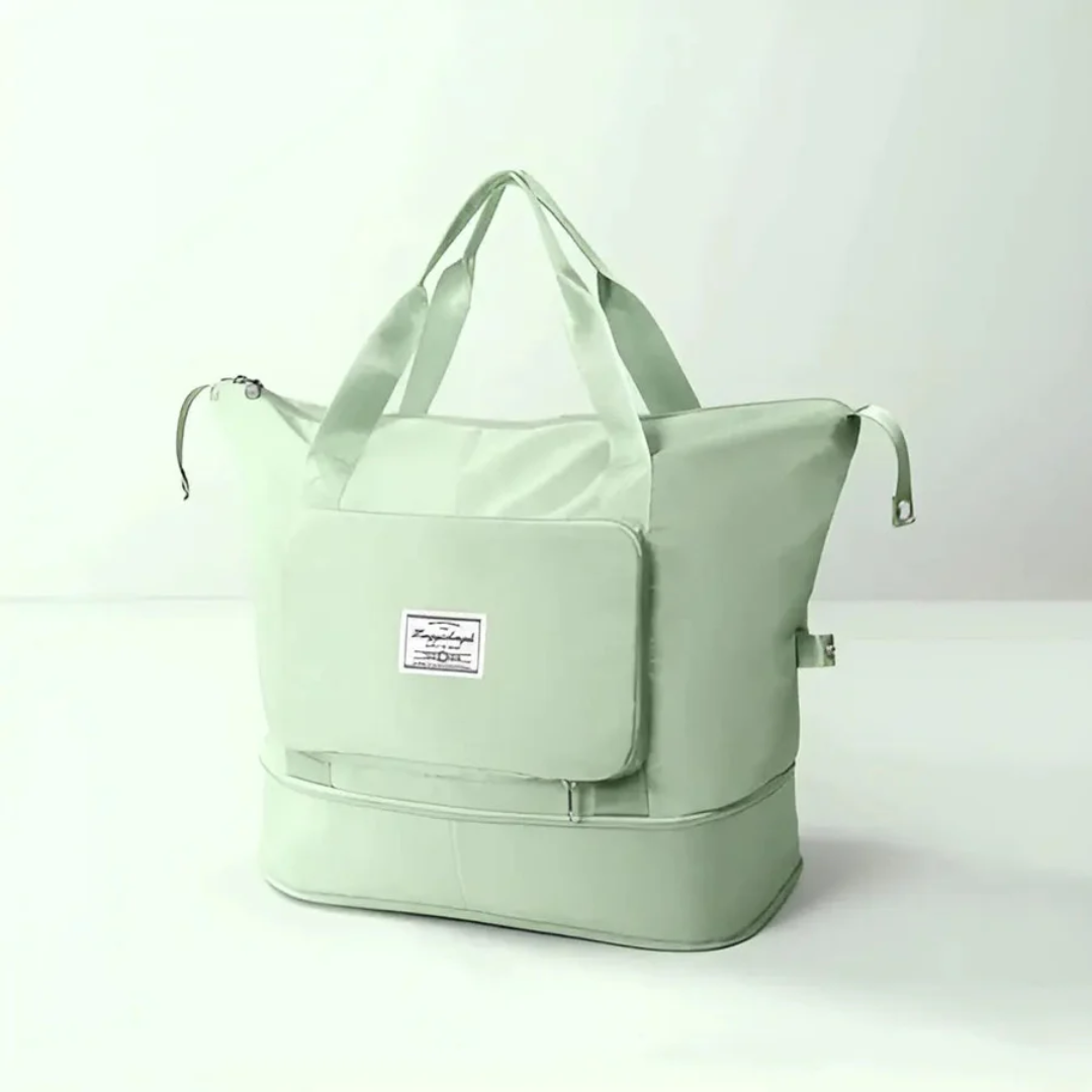 Hellgrüne Reisetasche mit Reißverschluss, großem Hauptfach und Tragegriffen.