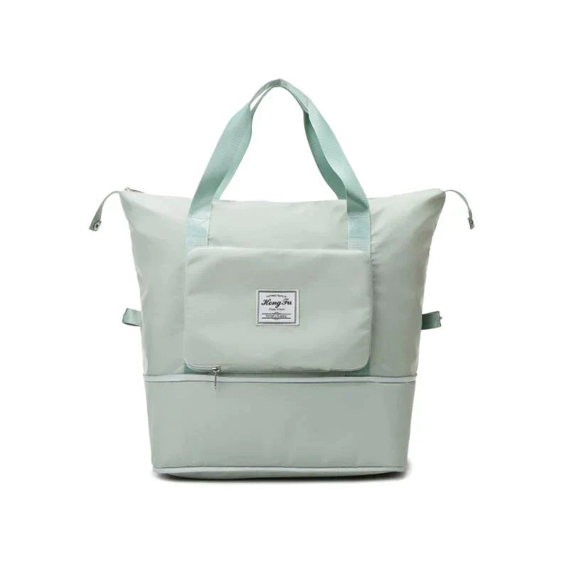 Hellgrüne Reisetasche, faltbar, mit Reißverschluss, Fronttasche, Tragegriffen, Unisex-Design.