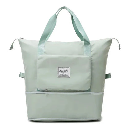 Mintgrüne Wickeltasche, wasserabweisend, mit Reißverschluss und Tragegriffen, ideal für Eltern.
