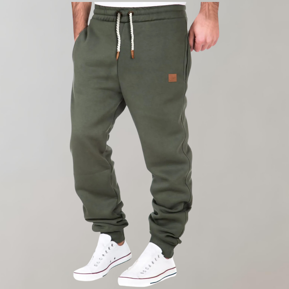 Grüne Herren-Jogginghose, Kordelzug, Baumwolle, bequem, sportlich, Freizeitmode.