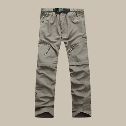 Graue Outdoor-Cargohose mit Reißverschlusstaschen, verstellbarem Gürtel, strapazierfähiges Material.