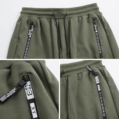 Grüne Jogginghose mit Reißverschlusstaschen, XIONGMAO-Logo, Baumwolle, Herrenmode.