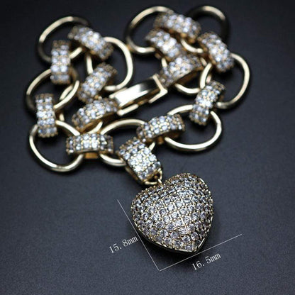 Goldenes Schmuckset mit Herzanhänger, Zirkonia-Steinen, Kette und Armband, luxuriöses Design.