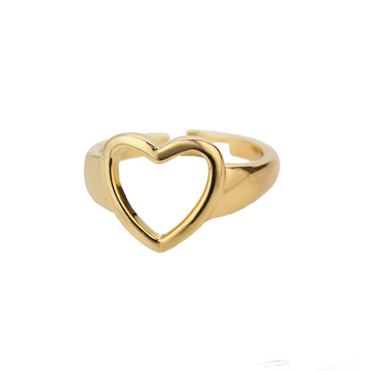 Goldener Herzring, offenes Design, Modeschmuck, Damenring, elegantes Accessoire, Geschenkidee.