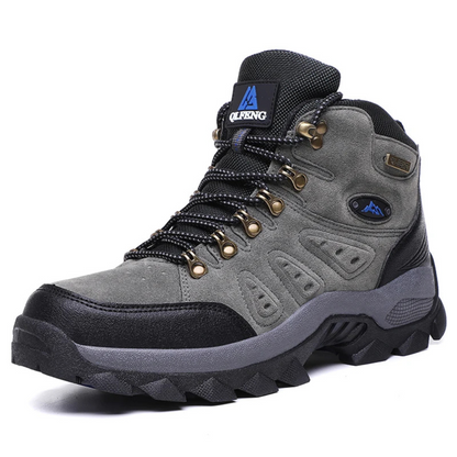 Grauer Wanderschuh aus Leder, wasserdicht, rutschfeste Sohle, ideal für Outdoor-Aktivitäten.