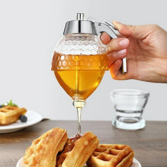 Honigspender aus Glas in Granatenform, gießt Honig auf Waffeln, ergonomischer Griff.