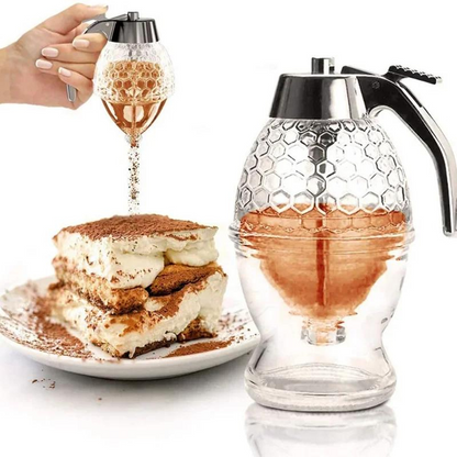 Honigspender aus Glas mit Wabenmuster, ideal für Desserts, ergonomischer Griff.