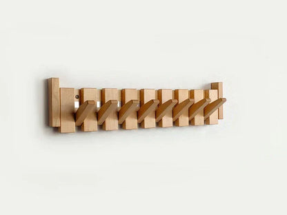 Holzgarderobe Wandhaken klappbar, platzsparend, modern, aus hellem Holz, für Flur oder Büro.