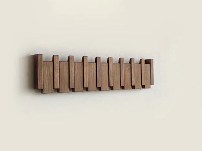 Moderner Holz-Wandhaken, klappbar, platzsparend, für Flur oder Garderobe, minimalistisches Design.