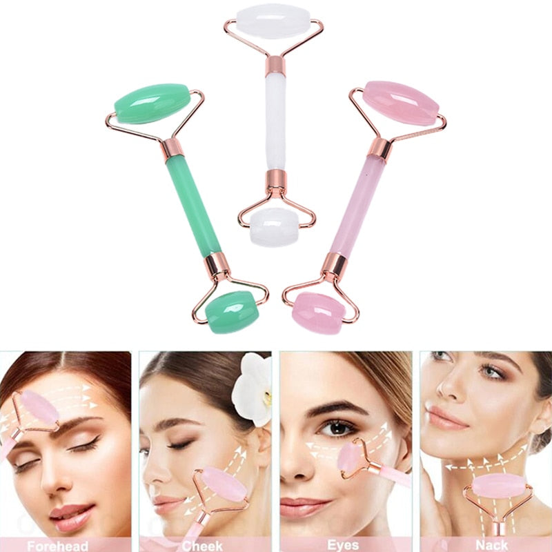 Drei Gesichtsmassage-Roller aus Jade und Rosenquarz, grün, weiß, rosa, für Hautpflege.