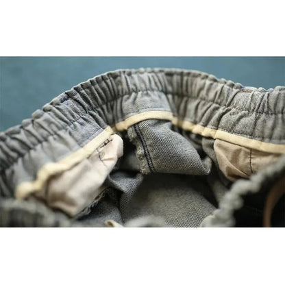 Graue Jeans mit elastischem Bund, Innenansicht, Baumwolle, bequem, langlebig, modisch.