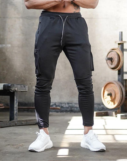 Schwarze Jogginghose Herren, Sportbekleidung, Fitnessstudio, elastisch, mit Taschen.