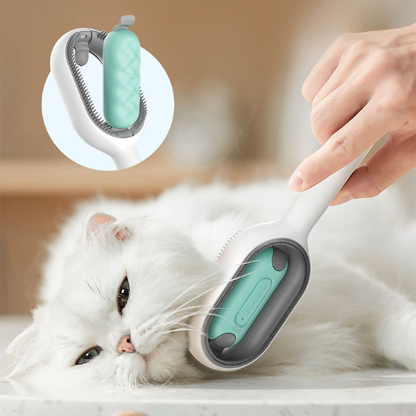 Katzenbürste mit ergonomischem Griff, weiß, für sanfte Fellpflege bei Katzen.