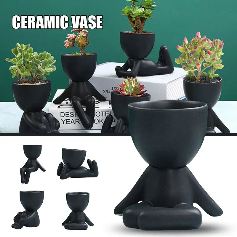 Schwarzer Keramik-Blumentopf in Menschenform, ideal für Sukkulenten, modernes Design.