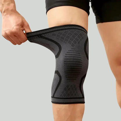 Graue Kniebandage für Sport, Kompression, elastisch, atmungsaktiv, Unisex, Fitness.