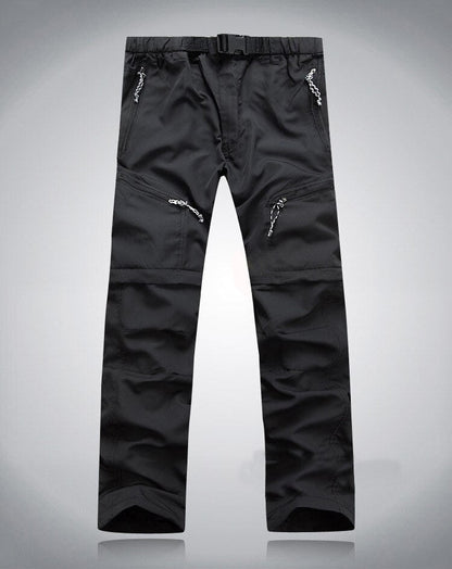 Schwarze Outdoor-Performance-Hose mit Reißverschlusstaschen und verstellbarem Bund.