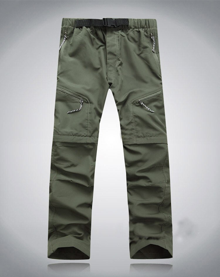 Grüne Outdoor-Hose, elastisch, mit Reißverschlusstaschen, ideal für Wandern und Trekking.