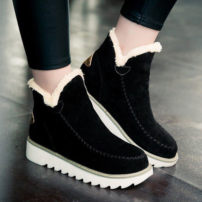Schwarze Damen-Halbstiefel mit weißem Kunstfell, rutschfeste Sohle, warm und modisch.